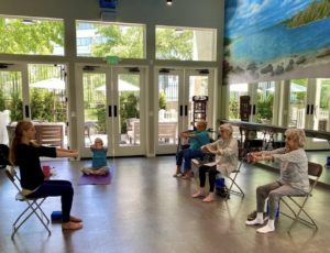 Seniors doing yoga and chair Fitness