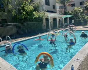 Seniors doing Fitness in the pool with floaties and plastic tubes