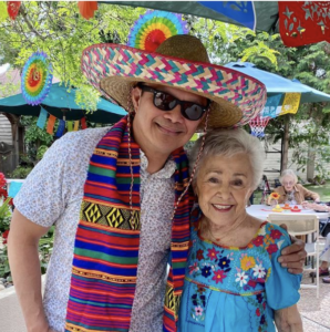 A guy and his mother outside celebrating
