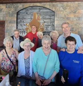 A group of seniors taking a photo