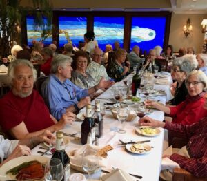 Seniors eating at the restaurant at the Heritage downtown sitting at a table
