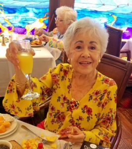 Senior raising her glass as a toast