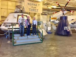 Several Heritage Downtown residents on a tour of a helicopter museum