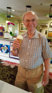 Heritage Downtown male resident holding an ice cream cone
